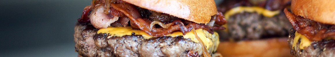 Eating Burger at Grub Burger Bar restaurant in Tallahassee, FL.